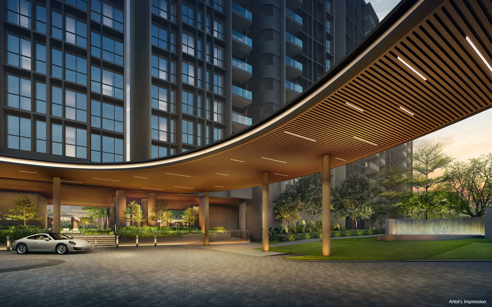 Clovelle of Woodlands EC main drop-off with curved timber canopy, landscaped lawn and residential blocks at dusk